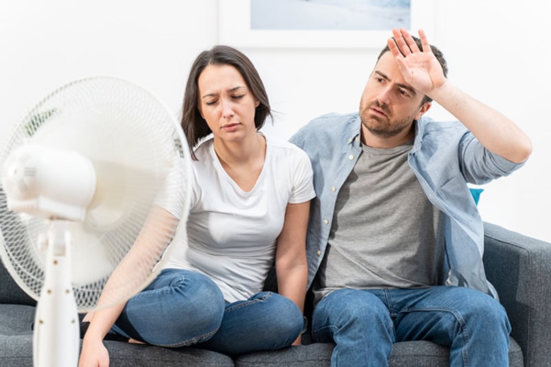Couple trying to refresh during summer heat wave.